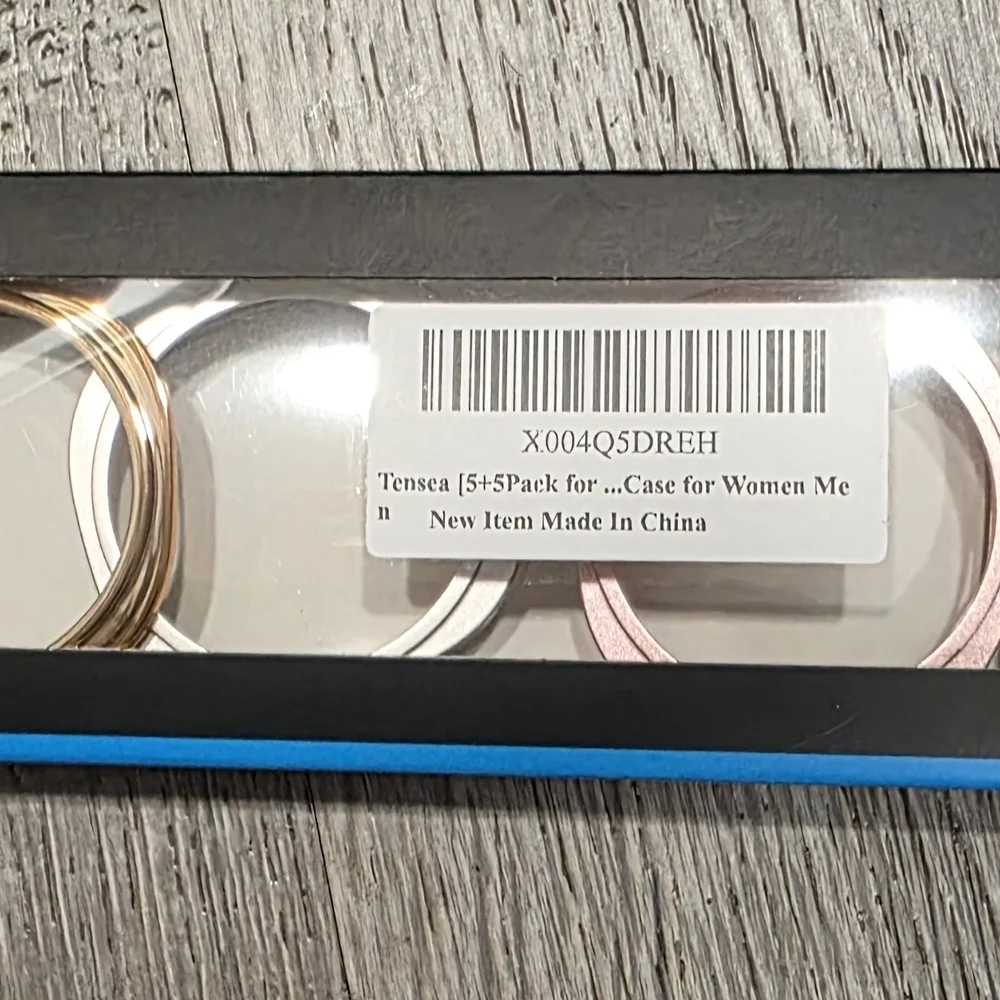 Set of Three Bangles in Silver, Gold, and Black